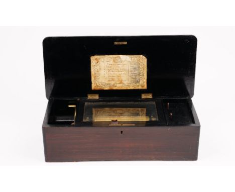 A Swiss rosewood cased cylinder music box, circa 1880, playing 'Eight Airs on a Six', brass roller, 43cm wide x 13cm high x 1