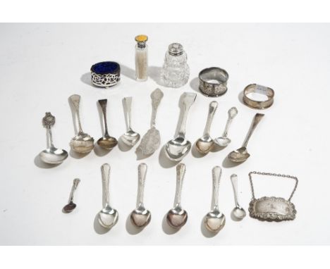 Silver and silver mounted wares, comprising; two napkin rings, an oval salt with a blue glass liner, a salt spoon, a decanter