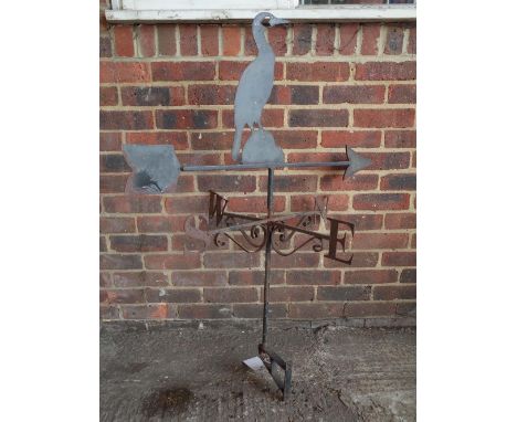 A wrought iron weather vane with cormorant mount, 65cm wide x 118cm high. 