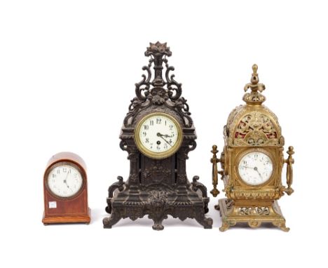 A Victorian Continental gilt brass mantel clock of lantern form, with acanthus moulded finial, painted ceramic dial, 24cm wid