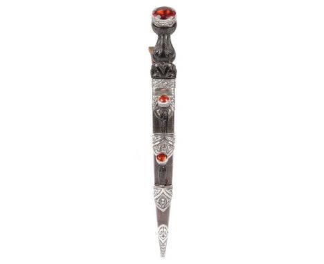 A Scottish Dirk, early 20th century with polished steel blade, 23.5 cm, ornate thistle carved hard wood handle and large ambe