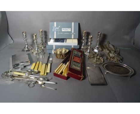 Silver plated items of mostly early 20th century including:  pairs of candlesticks, flatware, photograph frames and sundry (q