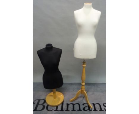 A modern female mannequin torso, on stained beech tripod base and another similar. 