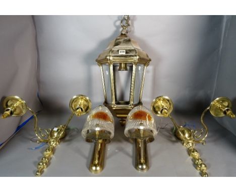 A group of lighting, comprising hexagonal hall lantern, 63cm high, a pair of twin branch wall lights, 38cm high, and a pair o