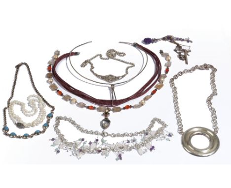 A single row necklace of graduated cultured pearls, on a silver and cultured pearl clasp, a silver pendant necklace, the fron