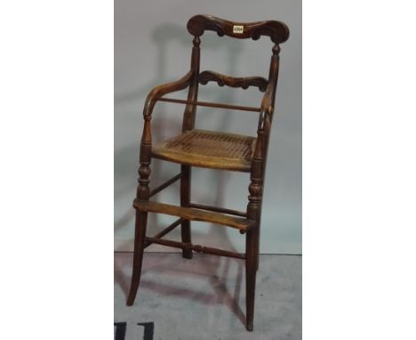 A 19th century faux rosewood child's high chair, on splayed supports, 38cm wide x 88cm high, together with a rush seated ladd