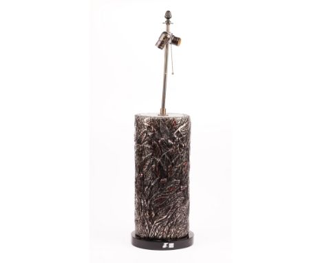 A silvered carved wooden lamp, 80cm high, with a shade.