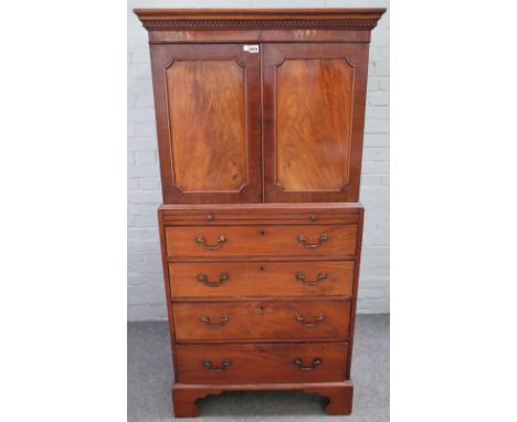 A small George III mahogany linen press, the pair of doors over four long graduated drawers, on bracket feet, 84cm wide x 175