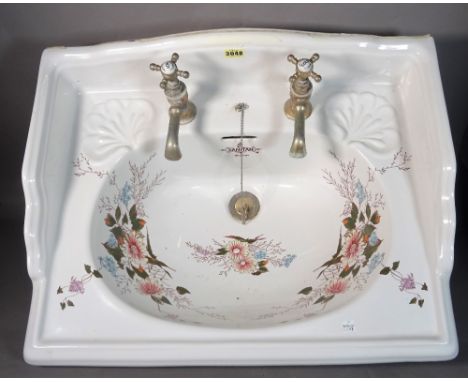 SANITAN, a modern galleried ceramic sink with floral decoration, 63cm wide x 10cm high. 