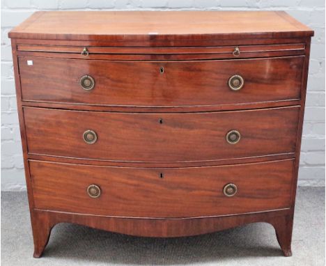 A George III mahogany bowfront chest, the brushing slide over three long graduated drawers on splayed bracket feet, 106cm wid