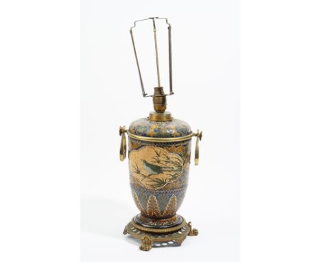 A Doulton Lambeth stoneware oil lamp (converted to electricity), dated 1881, decorated by Florence Barlow with two quatrelobe