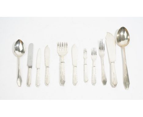 A table service of flatware, decorated in an Art Deco inspired design, comprising; eleven table forks, eleven dessert forks, 