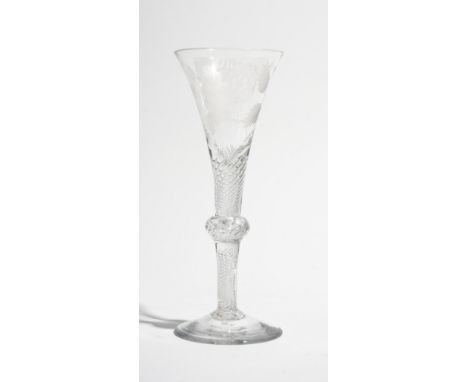 An engraved Jacobite composite stemmed  wine glass, circa 1740, the drawn trumpet bowl engraved with a rose and two buds , th