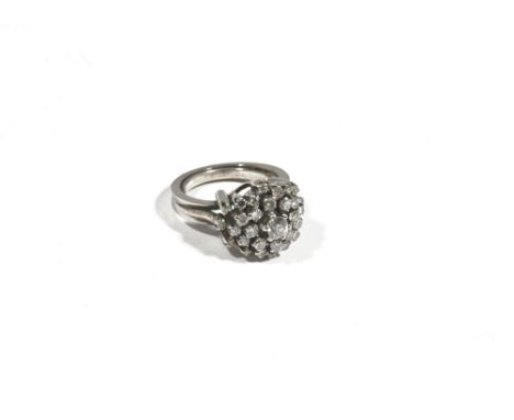 A diamond-set ring of cluster design, set with circular-cut diamonds approximately 1.10ct total diamond weight, claw set in a