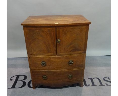 A Regency mahogany bowfront commode chest, with two short drawers on splayed bracket feet, 61cm wide x 76cm high. 