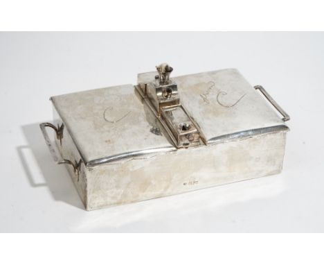 A late Victorian silver rectangular, twin compartment, twin handled table cigar box, the two hinge lidded rectangular compart