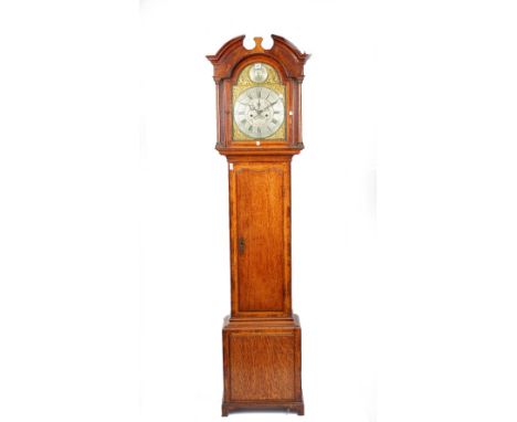 An oak longcase clock, early 19th century, the arch top dial over a brass plate with silvered chapter ring, detailed 'Benjami