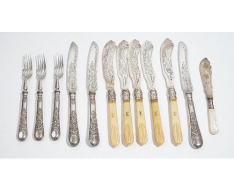 Five Victorian silver bladed fish knives, having engraved decoration and with carved ivory handles, Birmingham 1871, three pa