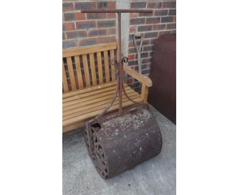 An early 20th century cast and wrought iron garden roller, 60cm wide. 