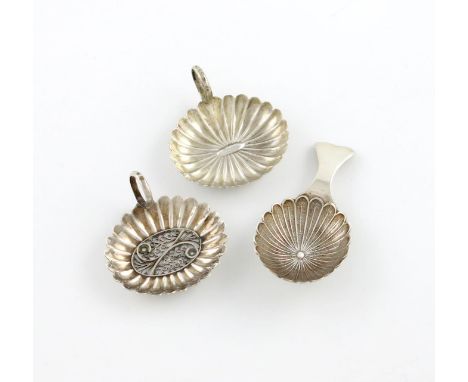 A George III silver caddy spoon, by Samuel Pemberton, Birmingham 1807, oval fluted bowl, the centre set with a filigree panel