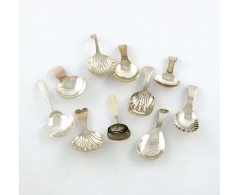 A collection of ten antique silver caddy spoons, comprising: one with an engraved shaped bowl, by Joseph Taylor, Birmingham 1