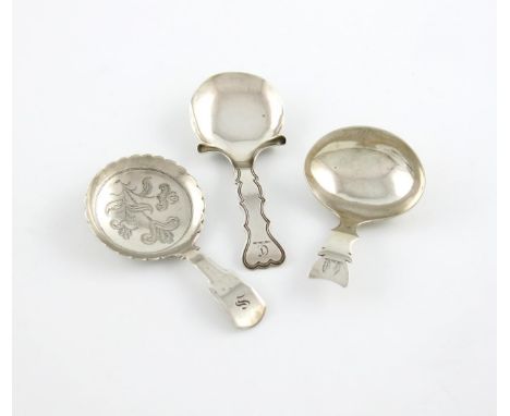 A small collection of three antique silver caddy spoons, comprising: a George IV one, by Francis Powell, London 1821, circula