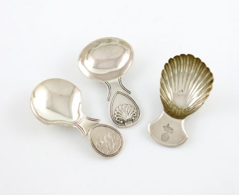 A George III silver caddy spoon, by Josiah Snatt, London 1813, fluted bowl, the terminal with a crest, plus a George IV silve