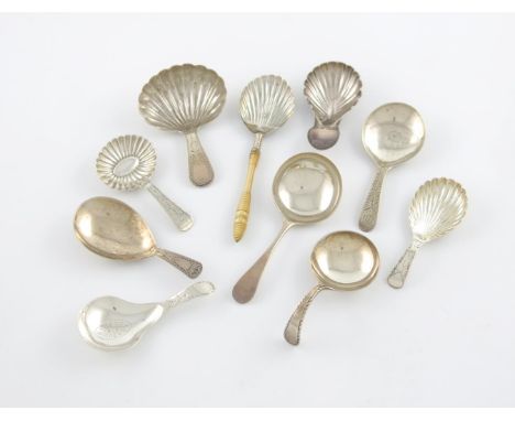 λ A collection of ten antique silver caddy spoons, various designs, comprising: one by Urquhart and Hart, London 1802, fluted