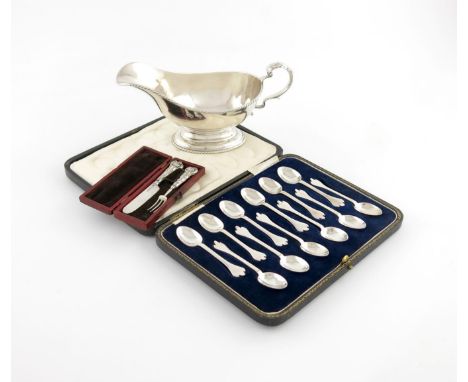 A mixed lot of silver items, comprising: a sauce boat of oval form, rope-work border, Birmingham 1922, plus a cased set of tw