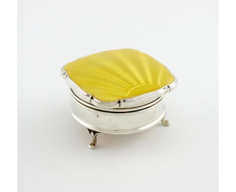 A silver-mounted enamel dressing table box, by Walker and Hall, Sheffield 1933, circular form, the shaped square hinged cover