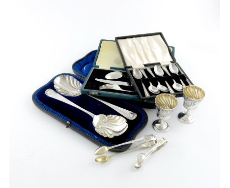 A mixed lot of silver flatware, various dates and makers, comprising: a pair of Edwardian fruit serving spoons, by Jackson an