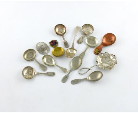 A mixed lot of caddy spoons, comprising: an American one with a large leaf shaped bowl, a modern jockey cap spoon, a sugar sp