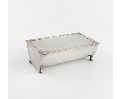 A silver cigarette box, by A. E. Poston & Co, Birmingham 1939, half cylindrical form, the hinged cover with a foliate border 
