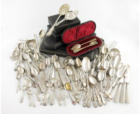 λ A mixed lot of silver flatware, various dates and makers, comprising: a cased silver cream ladle and sugar sifting spoon, a