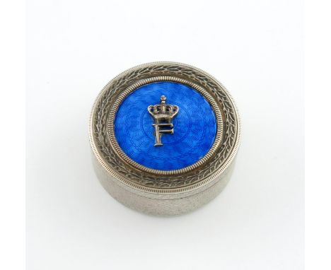 An Egyptian silver and enamel box, circular form, the pull-off cover with blue enamel and applied with a crowned F, for King 