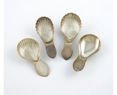 A collection of four Sheffield made antique silver caddy spoons, comprising: one by Richard Morton, Sheffield 1786, fluted bo