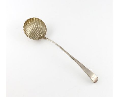 A George III silver Feather-edge pattern soup ladle, marks worn, London circa 1775, fluted circular bowl, the terminal with a