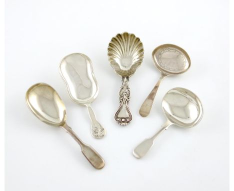 A collection of five antique Exeter made silver caddy spoons, comprising: one with a leaf finial, 1848, a variant King's shap