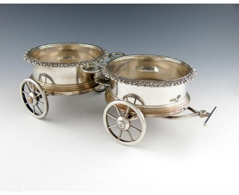 An early 19th century old Sheffield plated decanter trolley, unmarked, circa 1820, double circular form, foliate borders, woo