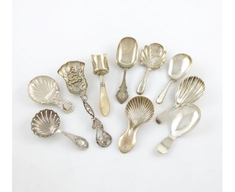 A collection of ten antique silver caddy spoons, various designs, comprising: one by George Unite, Birmingham 1863, engraved 