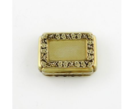 A George III silver-gilt vinaigrette, by Matthew Linwood, Birmingham 1816, rectangular form, embossed fruiting vine and engin