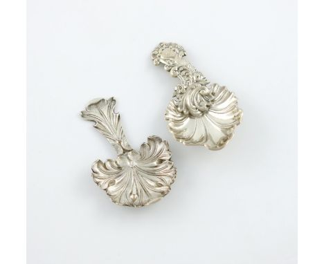 A Victorian silver caddy spoon. by The Martin Brothers and Co., Sheffield 1850, fluted leaf shaped bowl, foliate handle, engr