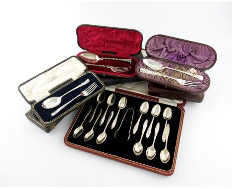 A mixed lot of cased silver flatware sets, comprising: a set of twelve teaspoons and tongs, Sheffield 1923, four spoon and fo