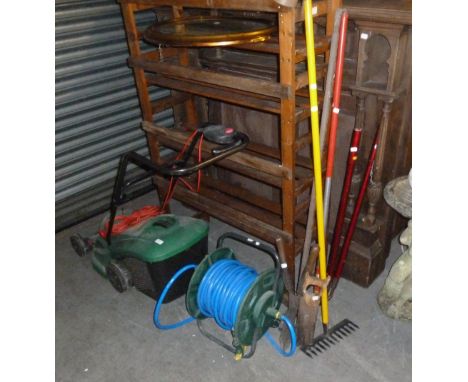 A QUALCAST ELECTRIC ROTARY LAWN MOWER, A GARDEN HOSE ON REEL AND GARDEN TOOLS 