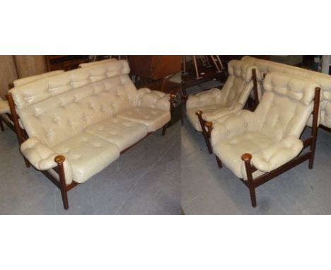 STYLISH CIRCA 1960'S TEAKWOOD FRAMED LOUNGE SUITE OF 3 PIECES, THE FRONT LEGS EXTENDING  AS ARM RESTS, CAPPED OFF WITH CIRCUL