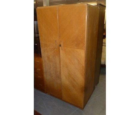 A LIGHT OAK TWO DOOR WARDROBE AND MATCHING DRESSING CHEST OF FOUR LONG DRAWERS AND MIRROR 