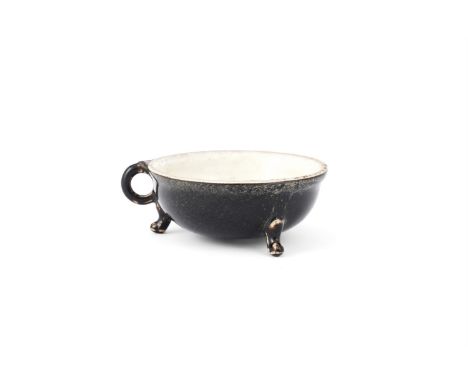 A CHINESE 'GONGXIAN' BLACK GLAZED TRIPOD TEA CUP SONG/JIN DYNASTY, 12TH/13TH CENTURY With a mottled black glaze to the exteri