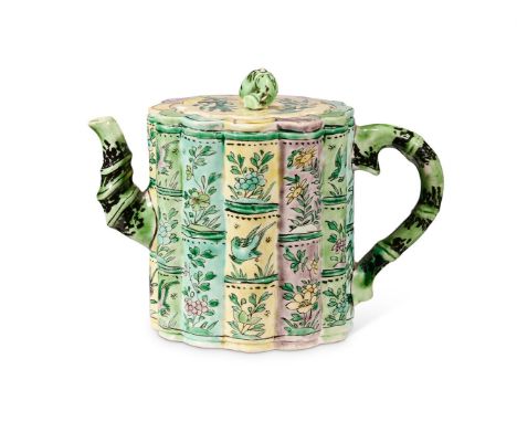 A CHINESE FAMILLE VERTE 'BAMBOO' TEAPOT AND COVER KANGXI PERIOD (1662-1722) The cylindrical body vertically moulded in twelve