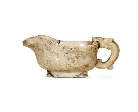 A CHINESE CELADON AND BLACK JADE LIBATION POURING VESSEL, YI SONG OR MING DYNASTY The body incised with dragons amongst cloud