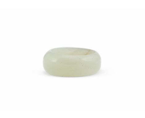 A CHINESE PALE CELADON JADE RING QING DYNASTY, 18-19TH CENTURY With russet inclusions  Inner diameter approximately 1.5cm and